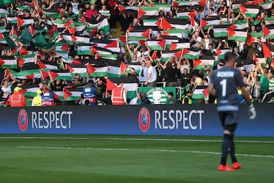 Celtic fans hold up Palestine flags during the match against Israeli side Hapoel Be’er Sheva. Reuters