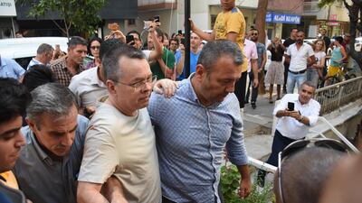 epa06910221 US pastor Andrew Brunson (C) is released from jail and will be put under house arrest during the duration of his trial, at Aliaga Prison in Izmir, Turkey, 25 July 2018. The US pastor has been in custody for two years under terror and espionage charges. EPA/MUSTAFA KOPRULU