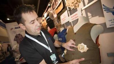 Stewart Liddell from Jack Ellis Body Protection, a Scottish company, shows a waistcoat that will "not only stop a spike, a knife and a 9mm round fired at close range, but looks entirely unobtrusive". Jaime Puebla / The National