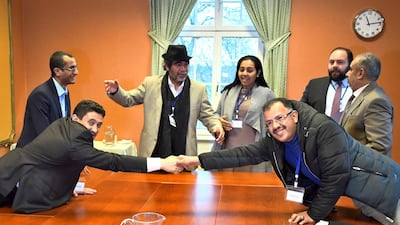 At left, Abdelqader Al Murtada and Saelem Mohammed Noman Al Mughalles, representatives of the Houthi delegation and at right, Askar Zaeil and Hadi Haig representing the delegation of the Government of Yemen react at the negotiating table together with representatives from the office of the UN Special Envoy for Yemen and the International Red Cross Committee (ICRC) when lists of prisoners were exchanged, during the ongoing peace talks on Yemen held at Johannesberg Castle, in Rimbo, near Stockholm, Sweden, December 11, 2018. Reuters