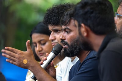 Cockroach Janta Party founder and president Abhijeet Dipke, centre, in New Delhi. EPA