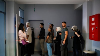 People wait to vote during Turkey's presidential and parliamentary elections at a polling station in Istanbul, Turkey, on June 24, 2018. Alkis Konstantinidis / Reuters