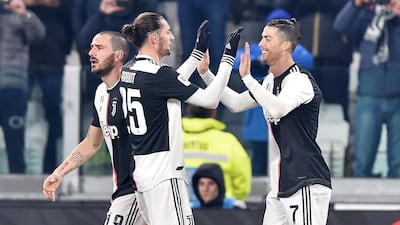 Cristiano Ronaldo, right, celebrates after scoring. EPA