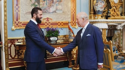 Syrian President Ahmad Al Shara, left, meets Britain's King Charles III at Buckingham Palace in London. Photo: Syrian Presidency