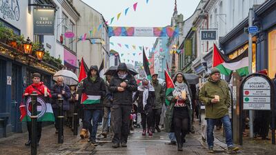 A walking vigil makes its way through the streets of Falmouth, England for aid worker James Henderson, who was killed in an Israeli air strike. Getty Images