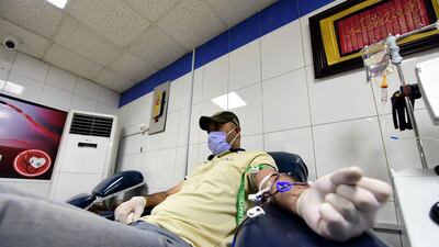 A recovered Covid-19 patient donates his blood and plasma profiled for treatment at the blood transfusion unit of Baghdad Medical City, Iraq. EPA