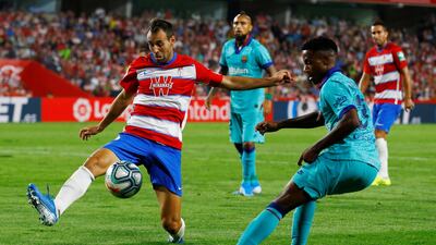 Granada's Victor Diaz in action with Barcelona's Ansu Fati. Reuters