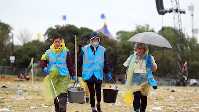 It's a major operation to de-litter the Somerset dairy farm after 200,000 people attended the festival. EPA