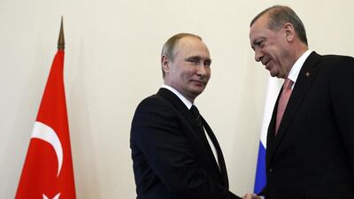 Russian president Vladimir Putin, left, welcomes Turkish president Recep Tayyip Erdogan in the Konstantin palace outside St Petersburg, on August 9, 2016. Alexander Zemlianichenko/AP Photo