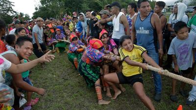 Guna indigenous women compete in the tug-of-war. AP