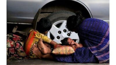 A reader objects to the Indian government's declaration that anyone earning over Dh2 a day is above the poverty line, arguing that poverty in India is far different than conditions for 'poor' people in the West. Adnan Abidi / Reuters