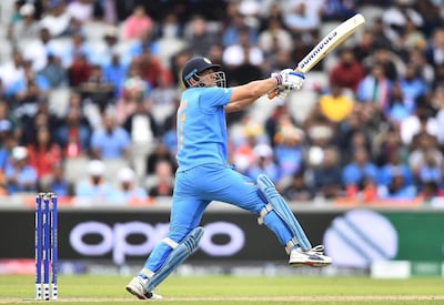 MANCHESTER, ENGLAND - JULY 10: MS Dhoni of India hits a six during resumption of the Semi-Final match of the ICC Cricket World Cup 2019 between India and New Zealand after weather affected play at Old Trafford on July 10, 2019 in Manchester, England. (Photo by Nathan Stirk/Getty Images)