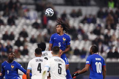 France defender Jules Kounde goes for a header during the Nations League match against Israel at the Stade de France. AFP