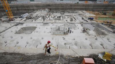Labourers work at a construction site in Beijing, China.Economic growth is set to fall slightly. Jason Lee / Reuters