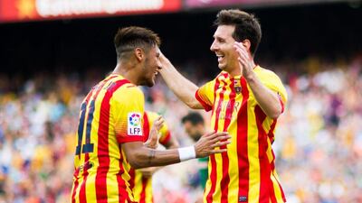 Neymar, left, and Lionel Messi celebrate after Neymar's second goal in Barcelona's win over Athletic Bilbao in La Liga on Saturday. Alex Caparros / Getty Images / September 13, 2014