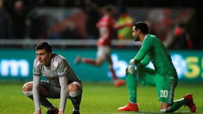 Manchester United’s Victor Lindelof and Sergio Romero after Bristol City's Korey Smith scores the winning goal. John Sibley / Reuters