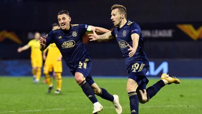 Mislav Orsic of GNK Dinamo Zagreb celebrates with Arijan Ademi after scoring their side's third goal. Getty Images