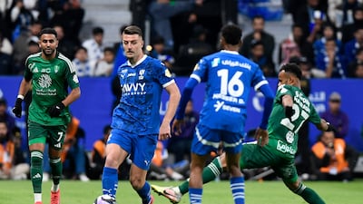 Al Hilal's Sergej Milinkovic-Savic in action with Al Ahli's Riyad Mahrez. Reuters
