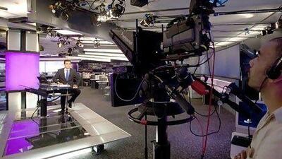 News presenter Soheb Cherair, left, at the Al Arabiya studio in Dubai Media City. Two more news channels will be entering the crowded sector this year, joining Al Jazeera and Al Arabiya. Jaime Puebla / The National