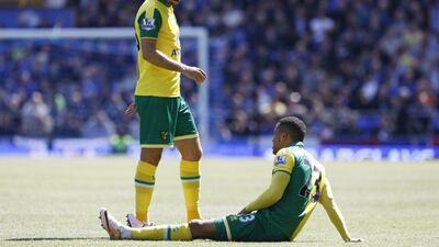 Norwich's Martin Olsson down injured before going off. (Reuters/Craig Brough)