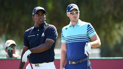 Rayhan Thomas, left, played his final round at the Omega Dubai Desert Classic alongside reigning US Masters champion Danny Willett. Ross Kinnaird / Getty Images