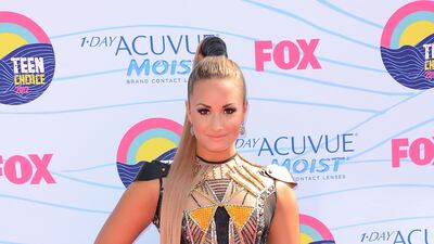 Demi Lovato, in Falguni and Shane, arrives at the Teen Choice Awards at Gibson Amphitheatre on July 22, 2012 in Universal City, California. Getty Images