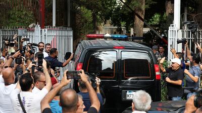 Protesters and media personnel gather near a vehicle from the convoy of former Lebanese central bank chief Riad Salameh as it arrives at the Justice Palace in Beirut, on September 9, 2024. Reuters