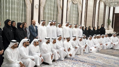 Sheikh Mohammed bin Zayed, Crown Prince of Abu Dhabi and Deputy Supreme Commander of the Armed Forces, stands for a photograph with UAE Space and Astronomy sector employees during an iftar reception at Al Bateen Palace on Monday evening. Hamad Al Kaabi / Crown Prince Court Abu Dhabi