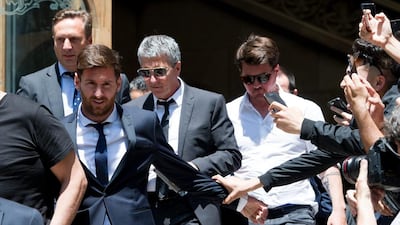 Lionel Messi leaves the courthouse followed by his father Jorge Horacio Messi, second right, and his brother Rodrigo Messi, right. Alex Caparros / Getty Images