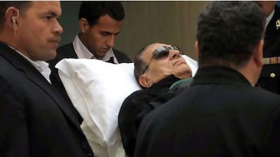Former Egyptian president Hosni Mubarak arrives on a stretcher for a new hearing in Cairo last week. Prosecutors demanded that Mubarak be executed for alleged involvement in killing hundreds of protesters.