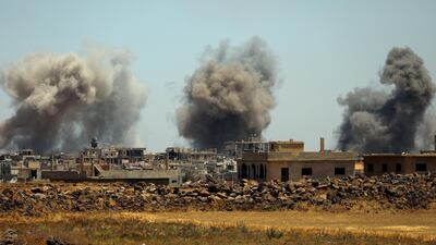 FILE PHOTO: Smoke rises from al-Harak town, as seen from Deraa countryside, Syria June 25, 2018. REUTERS/Alaa al-Faqir/File Photo