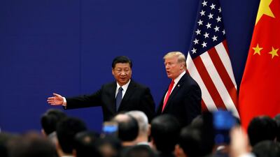 Then US president Donald Trump and Chinese President Xi Jinping meet business leaders in Beijing, in 2017. Reuters