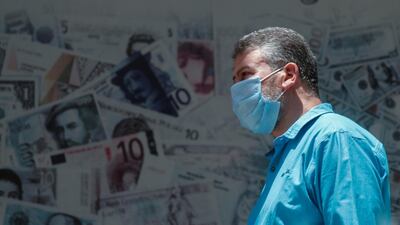 A man walks past a currency exchange shop in central Cairo, Egypt. Reuters