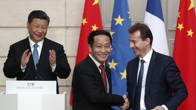Chinese President Xi Jinping (L), Airbus' Guillaume Faury (R) and chairman of China Aviation Supplies Jia Baojun at Airbus order signing ceremony at the Elysee Palace in Paris. AFP