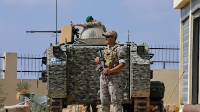 Lebanese soldiers stand guard in a village in southern Lebanon after Israeli forces withdrew. EPA