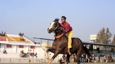 A participant at the horse racing event at the Kila Raipur Rural Sports festival.
