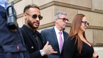 Neymar leaves court with his mother, Nadine Goncalves after standing trial on fraud and corruption charges. Reuters