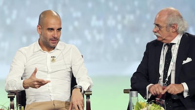 Bayern Munich head coach Pep Guardiola, left, says he wants the ability to make more than three substitutions per match. Mohammed Omar / Reuters