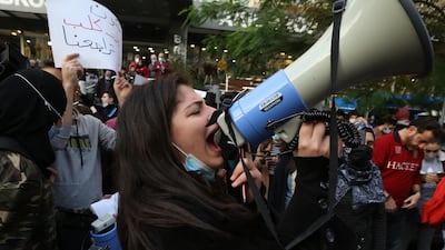 Students from different universities carry placards, wave Lebanese flags during a demonstration under the slogan of 'A Day of Student Rage' in Al-Hamra, Beirut. EPA
