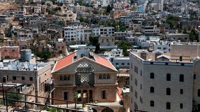Tthe Israeli settlement point of Beit Hadasa with Palestinian neighborhoods in the background, in the city of Hebron in the occupied West Bank. AFP