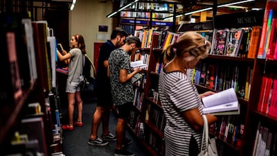 Customers browse through the books in the "El Ateneo Grand Splendid" bookstore. AFP