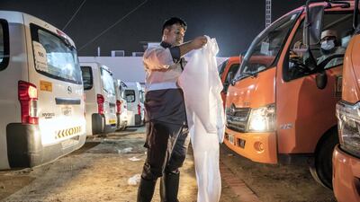 Sharjah municipal staff prepare to disinfect the emirate's streets. Antonie Robertson / The National