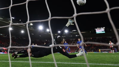 Grimsby's Irish midfielder Gavan Holohan scores his second goal from the penalty spot during the English FA Cup fifth round match against Southampton at St Mary's Stadium in Southampton. AFP