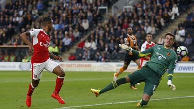 Arsenal’s Theo Walcott scores their second goal. Russell Cheyne / Reuters