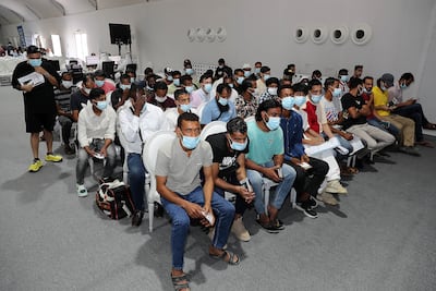 Staff at Dubai's Al Awir Centre have completed the visa paperwork for 2,393 people. Pawan Singh / The National