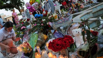 Nineteen children and two adults were killed in the shooting. AFP