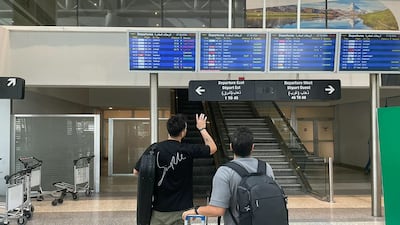 Passengers checking departures at Beirut International airport. The UK government has told British citizens in Lebanon to 'leave now'. AFP