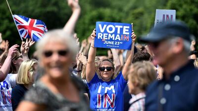 A woman holds a placard at a 'Britain Stronger in Europe', rally on June 19, 2016. Polls indicate the 'Remain' camp has edged ahead after the murder of Labour member of parliament Jo Cox. Ben Stansall / Agence France-Presse i