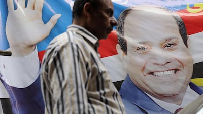 A man walks by a poster of Egyptian President Abdel Fattah al-Sisi for the upcoming presidential election, in Cairo, Egypt March 19, 2018. Mohamed Abd El Ghany / Reuters