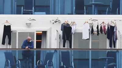 A passenger is seen on a balcony of the Diamond Princess cruise ship. AFP